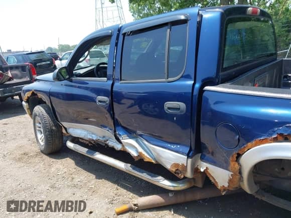 2004 Dodge Dakota SLT with VIN 1D7HG48N94S643579, listed as a IAAI auction lot 42457885 with 165,445 mi miles and . Bid and sale history available at DreamBid. Image 14.