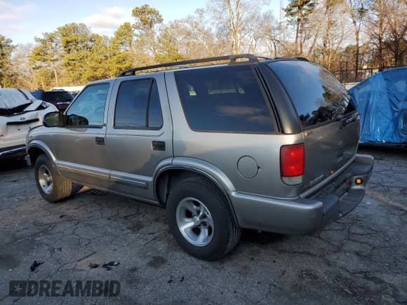 2000 Chevrolet Blazer LS z VIN 1GNCS13W6Y2365299, wystawiony jako Copart lot #41368365 z przebiegiem 144 294 mil mil oraz Szkoda całkowita • Salvage title. Historia ofert i sprzedaży dostępna na DreamBid. Obrazek 2.