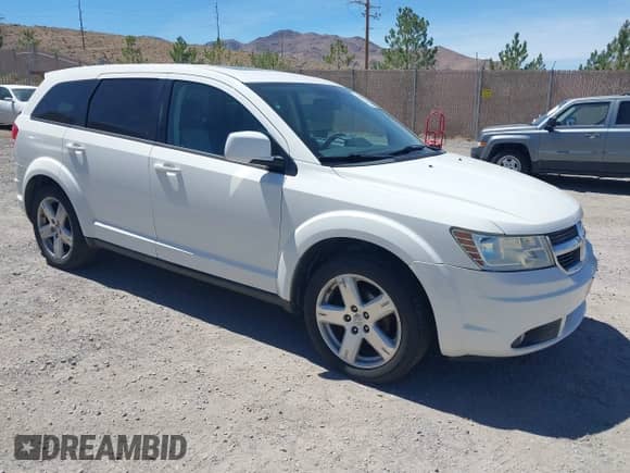 2009 Dodge Journey SXT z VIN 3D4GH57VX9T594749, wystawiony jako IAAI lot #42938171 z przebiegiem 216 081 mil mil oraz . Historia ofert i sprzedaży dostępna na DreamBid. Obrazek 1.