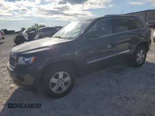 2011 Jeep Grand Cherokee Laredo z VIN 1J4RR4GG4BC590030, wystawiony jako Copart lot #70199405 z przebiegiem 204 419 mil mil oraz Szkoda całkowita • Salvage title. Historia ofert i sprzedaży dostępna na DreamBid. Obrazek 1.