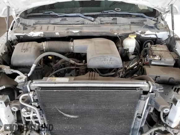 2018 Ram 1500 Tradesman z VIN 1C6RR6KGXJS219491, wystawiony jako Copart lot #52093895 z przebiegiem 212 925 mil mil oraz Szkoda całkowita • Salvage title. Historia ofert i sprzedaży dostępna na DreamBid. Obrazek 11.