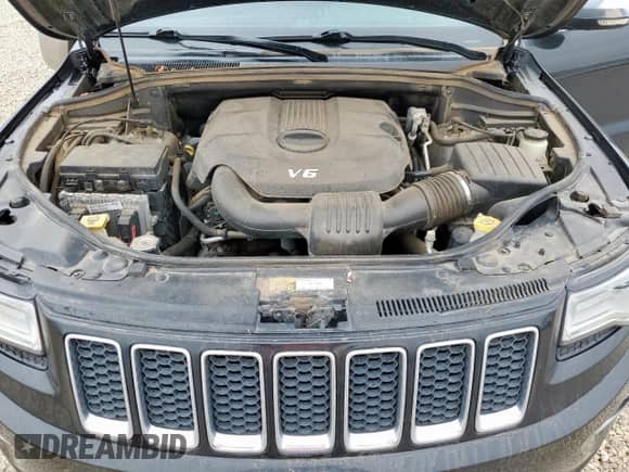 2015 Jeep Grand Cherokee Overland with VIN 1C4RJFCG7FC229492, listed as a Copart auction lot 82439445 with 104,257 mi miles and Salvage title. Bid and sale history available at DreamBid. Image 12.