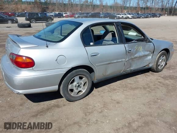 2004 Chevrolet Malibu Classic z VIN 1G1ND52F44M602447, wystawiony jako IAAI lot #41893008 z przebiegiem 127 027 mil mil oraz . Historia ofert i sprzedaży dostępna na DreamBid. Obrazek 4.