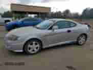 2003 Hyundai Tiburon GT с VIN KMHHN65F13U013420, выставлен на аукционе Copart как лот 51234495 с пробегом 230 612 миль миль и Списание • Salvage title. История ставок и продаж доступна на DreamBid. Изображение 1.
