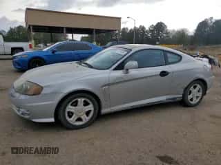 2003 Hyundai Tiburon GT с VIN KMHHN65F13U013420, выставлен на аукционе Copart как лот 51234495 с пробегом 230 612 миль миль и Списание • Salvage title. История ставок и продаж доступна на DreamBid. Изображение 1.