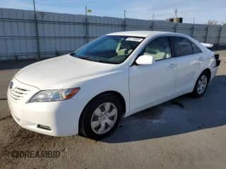 2007 Toyota Camry LE с VIN 4T1BK46K77U535943, выставлен на аукционе Copart как лот 84710565 с пробегом 131 771 миль миль и Списание • Salvage title. История ставок и продаж доступна на DreamBid. Изображение 1.