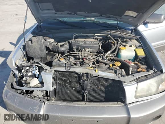 2004 Subaru Forester XS with VIN JF1SG65674H730022, listed as a Copart auction lot 71134505 with 157,196 mi miles and Salvage title. Bid and sale history available at DreamBid. Image 12.