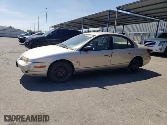 2000 Saturn SL with VIN 1G8ZK5274YZ103237, listed as a Copart auction lot 60558105 with 126,320 mi miles and Salvage title. Bid and sale history available at DreamBid. Image 1.