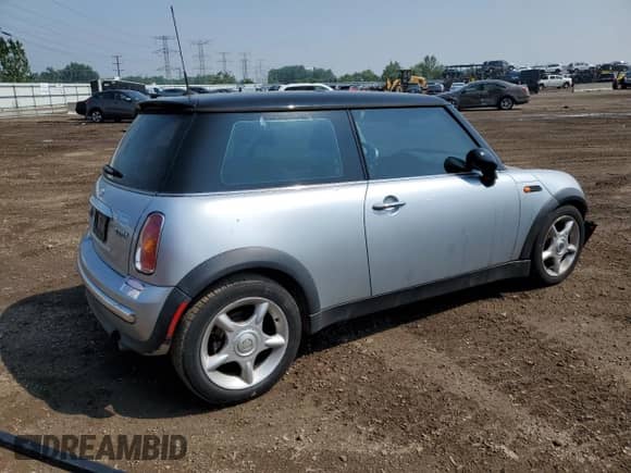 2004 MINI Hardtop with VIN WMWRC33454TJ56308, listed as a Copart auction lot 59690865 with 99,374 mi miles and Salvage title. Bid and sale history available at DreamBid. Image 3.