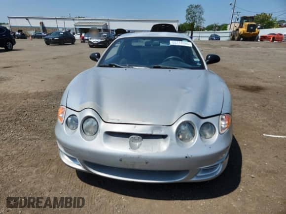 2001 Hyundai Tiburon с VIN KMHJG25FX1U237982, выставлен на аукционе Copart как лот 65774595 с пробегом 125 241 миль миль и Списание • Salvage title. История ставок и продаж доступна на DreamBid. Изображение 5.