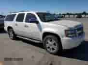 2010 Chevrolet Suburban LTZ with VIN 1GNUKKE30AR162869, listed as a Copart auction lot 68220215 with 195,348 mi miles and Clean title. Bid and sale history available at DreamBid. Image 4.