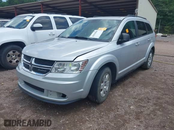 2012 Dodge Journey SE z VIN 3C4PDCAB6CT167734, wystawiony jako IAAI lot #42555850 z przebiegiem 188 988 mil mil oraz . Historia ofert i sprzedaży dostępna na DreamBid. Obrazek 2.
