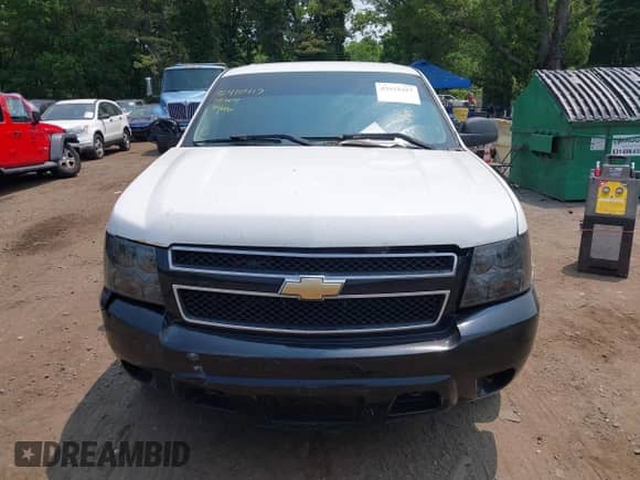 2014 Chevrolet Tahoe Commercial with VIN 1GNLC2E07ER228838, listed as a IAAI auction lot 42410417 with 140,342 mi miles and . Bid and sale history available at DreamBid. Image 12.