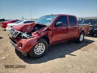 2016 Nissan Frontier S with VIN 1N6AD0ERXGN796847, listed as a Copart auction lot 68969855 with 200,318 mi miles and Salvage title. Bid and sale history available at DreamBid. Image 1.