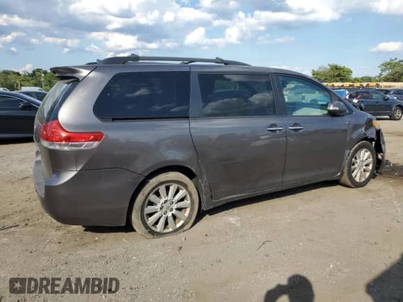 2014 Toyota Sienna Limited с VIN 5TDDK3DC0ES076338, выставлен на аукционе Copart как лот 69873955 с пробегом 183 756 миль миль и Списание • Salvage title. История ставок и продаж доступна на DreamBid. Изображение 3.