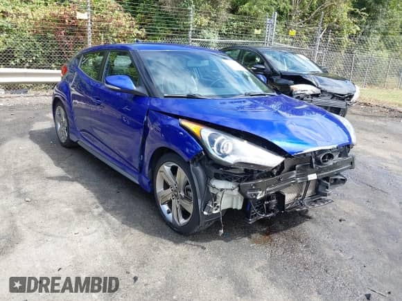 2013 Hyundai Veloster Turbo с VIN KMHTC6AE0DU141811, выставлен на аукционе IAAI как лот 43188913 с пробегом 117 067 миль миль и . История ставок и продаж доступна на DreamBid. Изображение 1.