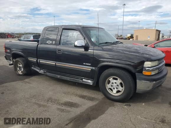 2002 Chevrolet Silverado 1500 LS with VIN 2GCEK19V721198314, listed as a Copart auction lot 82234815 with 120,359 mi miles and Salvage title. Bid and sale history available at DreamBid. Image 4.