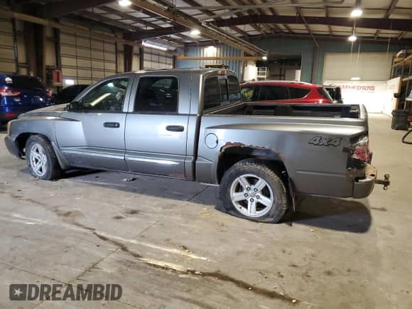 2007 Dodge Dakota Laramie with VIN 1D7HW58P77S270959, listed as a Copart auction lot 64900215 with 92,465 mi miles and Salvage title. Bid and sale history available at DreamBid. Image 2.