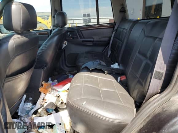 1998 Jeep Grand Cherokee Limited z VIN 1J4GZ78Y5WC185820, wystawiony jako Copart lot #67221725 z przebiegiem 280 414 mil mil oraz Szkoda całkowita • Salvage title. Historia ofert i sprzedaży dostępna na DreamBid. Obrazek 11.