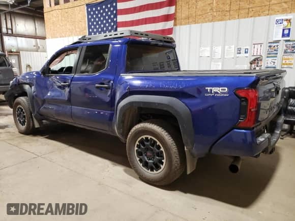 2024 Toyota Tacoma SR5 with VIN 3TMLB5JN1RM002946, listed as a Copart auction lot 68039525 with 21,113 mi miles and Salvage title. Bid and sale history available at DreamBid. Image 2.