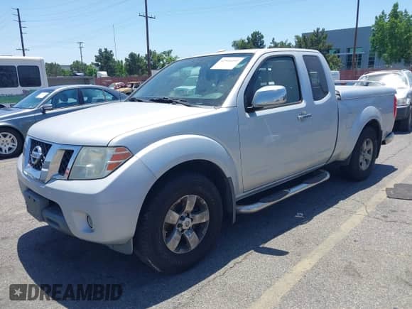 2013 Nissan Frontier SV with VIN 1N6AD0CU0DN711548, listed as a IAAI auction lot 42516591 with 143,340 mi miles and . Bid and sale history available at DreamBid. Image 2.