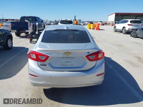 2018 Chevrolet Cruze LT z VIN 1G1BH5SEXJ7100003, wystawiony jako IAAI lot #41677824 z przebiegiem 100 935 mil mil oraz . Historia ofert i sprzedaży dostępna na DreamBid. Obrazek 16.