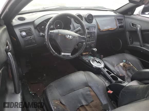 2003 Hyundai Tiburon GT с VIN KMHHN65F63U064962, выставлен на аукционе Copart как лот 44804045 с пробегом 186 171 миль миль и Списание • Salvage title. История ставок и продаж доступна на DreamBid. Изображение 8.