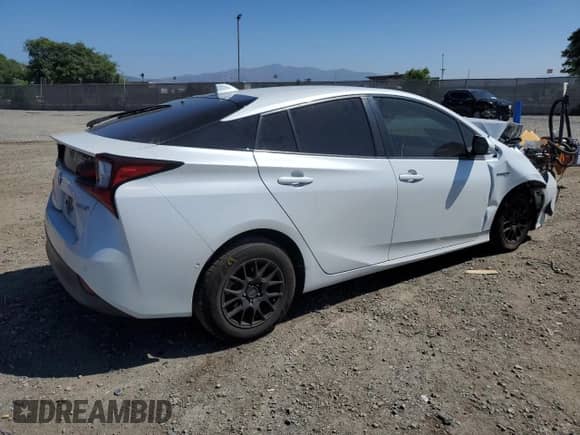 2021 Toyota Prius LE with VIN JTDL9MFU1M3027412, listed as a Copart auction lot 84287195 with 71,395 mi miles and Salvage title. Bid and sale history available at DreamBid. Image 3.
