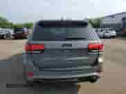 2020 Jeep Grand Cherokee SRT with VIN 1C4RJFDJ8LC158048, listed as a Copart auction lot 57426205 with 52,979 mi miles and Salvage title. Bid and sale history available at DreamBid. Image 6.