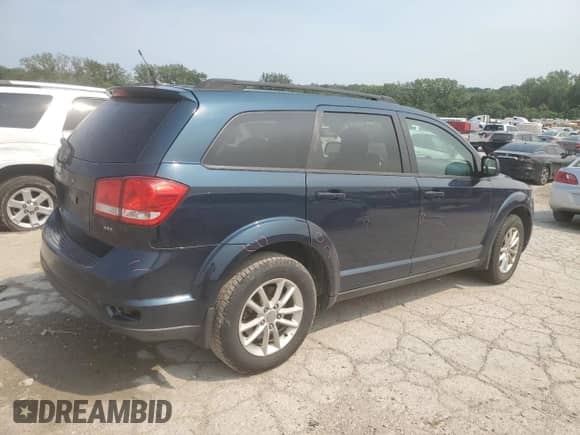 2014 Dodge Journey SXT with VIN 3C4PDCBBXET171609, listed as a Copart auction lot 67804315 with 127,593 mi miles and Salvage title. Bid and sale history available at DreamBid. Image 3.