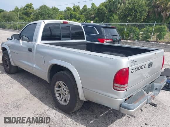 2002 Dodge Dakota with VIN 1B7FL36NX2S522194, listed as a IAAI auction lot 42366140 with 232,464 mi miles and . Bid and sale history available at DreamBid. Image 3.