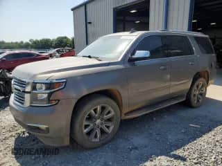 2017 Chevrolet Tahoe Premier with VIN 1GNSCCKC3HR356675, listed as a Copart auction lot 61758905 with 142,657 mi miles and Salvage title. Bid and sale history available at DreamBid. Image 1.