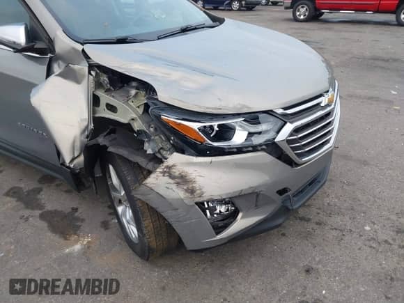2018 Chevrolet Equinox Premier with VIN 3GNAXMEV7JS547991, listed as a IAAI auction lot 41208640 with 98,879 mi miles and . Bid and sale history available at DreamBid. Image 6.
