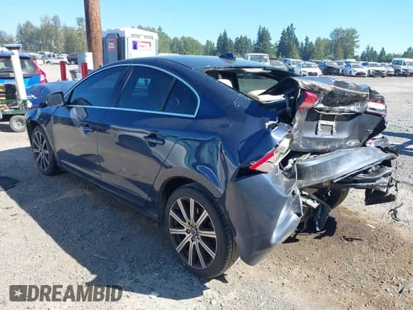 2015 Volvo S60 T5 Drive-E Premier with VIN YV126MFB5F1299795, listed as a IAAI auction lot 43052703 with 100,066 mi miles and . Bid and sale history available at DreamBid. Image 3.