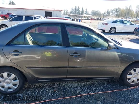 2003 Toyota Camry LE with VIN JTDBE32K530180767, listed as a IAAI auction lot 43276458 with 189,568 mi miles and . Bid and sale history available at DreamBid. Image 13.