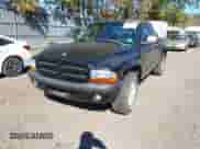 2002 Dodge Dakota Sport with VIN 1B7GG32N12S677909, listed as a IAAI auction lot 43502775 with 140,640 mi miles and . Bid and sale history available at DreamBid. Image 2.