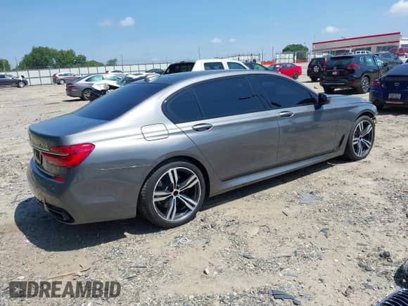 2017 BMW 7 Series ALPINA B7 xDrive with VIN WBA7F2C57HG421911, listed as a IAAI auction lot 42798037 with 124,549 mi miles and . Bid and sale history available at DreamBid. Image 4.