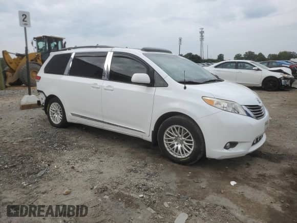 2012 Toyota Sienna XLE with VIN 5TDYK3DCXCS278781, listed as a Copart auction lot 83769325 with 157,885 mi miles and Salvage title. Bid and sale history available at DreamBid. Image 4.