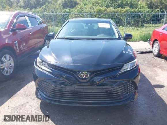 2020 Toyota Camry LE with VIN 4T1C11AKXLU877796, listed as a IAAI auction lot 43384594 with 78,546 mi miles and . Bid and sale history available at DreamBid. Image 12.