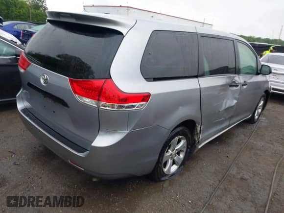 2014 Toyota Sienna L with VIN 5TDZK3DC7ES458064, listed as a IAAI auction lot 42192536 with 476,631 mi miles and . Bid and sale history available at DreamBid. Image 4.