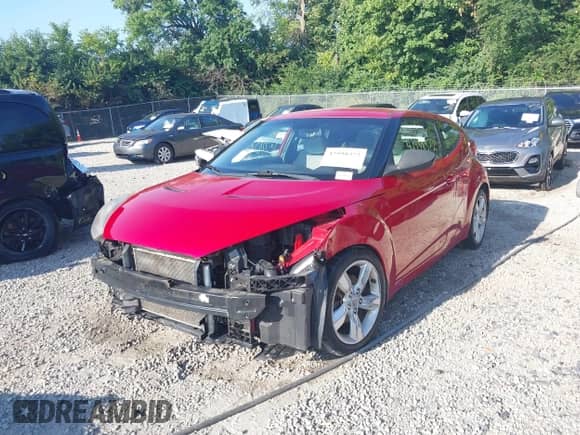 2013 Hyundai Veloster w/Black Int z VIN KMHTC6ADXDU128703, wystawiony jako IAAI lot #42998372 z przebiegiem 138 482 mil mil oraz . Historia ofert i sprzedaży dostępna na DreamBid. Obrazek 21.