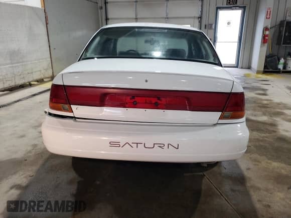 1997 Saturn SL с VIN 1G8ZK5272VZ252757, выставлен на аукционе Copart как лот 70937785 с пробегом 166 639 миль миль и Списание • Salvage title. История ставок и продаж доступна на DreamBid. Изображение 6.