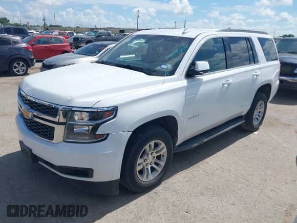 2018 Chevrolet Tahoe LS with VIN 1GNSKAKC8JR299452, listed as a IAAI auction lot 42575012 with 153,402 mi miles and . Bid and sale history available at DreamBid. Image 2.