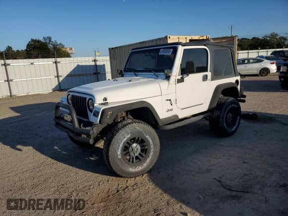 1999 Jeep Wrangler Sport with VIN 1J4FY19SXXP412760, listed as a Copart auction lot 84983895 with 180,172 mi miles and Clean title. Bid and sale history available at DreamBid. Image 1.