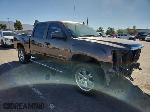 2007 GMC Sierra 1500 SLT with VIN 2GTFC13Y771715820, listed as a Copart auction lot 82659305 with 189,582 mi miles and Salvage title. Bid and sale history available at DreamBid. Image 4.