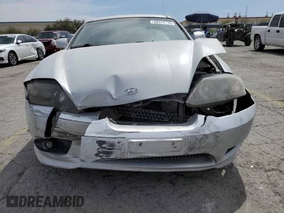 2006 Hyundai Tiburon GT z VIN KMHHN65F06U203701, wystawiony jako Copart lot #52374135 z przebiegiem 90 796 mil mil oraz Szkoda całkowita • Salvage title. Historia ofert i sprzedaży dostępna na DreamBid. Obrazek 5.