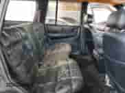 1994 Jeep Grand Cherokee Limited z VIN 1J4GZ78S5RC304501, wystawiony jako Copart lot #64632335 z przebiegiem 184 333 mil mil oraz Szkoda całkowita • Salvage title. Historia ofert i sprzedaży dostępna na DreamBid. Obrazek 11.