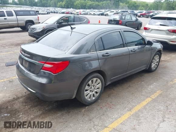 2014 Chrysler 200 LX with VIN 1C3CCBAB6EN204588, listed as a IAAI auction lot 42880103 with 112,465 mi miles and . Bid and sale history available at DreamBid. Image 4.