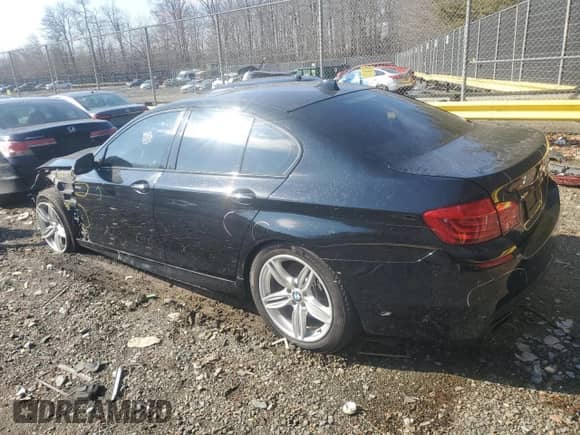 2015 BMW 5 Series 550i xDrive with VIN WBAKP9C55FD693954, listed as a Copart auction lot 89357405 with 121,474 mi miles and Salvage title. Bid and sale history available at DreamBid. Image 2.