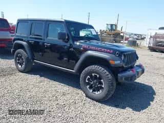 2024 Jeep Wrangler Rubicon z VIN 1C4PJXFG0RW321491, wystawiony jako IAAI lot #42461809 z przebiegiem 10 419 mil mil oraz . Historia ofert i sprzedaży dostępna na DreamBid. Obrazek 1.